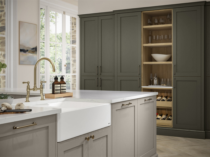 A sage and greige Mediterranean kitchen with a farmhouse sink