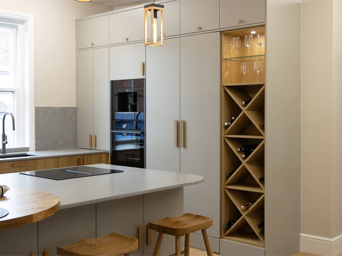 A green contemporary minimalist kitchen with a modern white kitchen design countertop