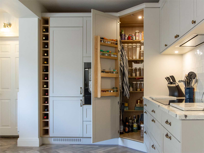 A minimalist-style kitchen corner with minimalist kitchenware and a deep corner pantry