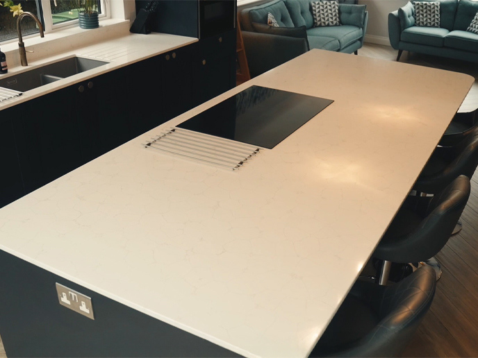 A kitchen island with seating that are ideal for parents with kids