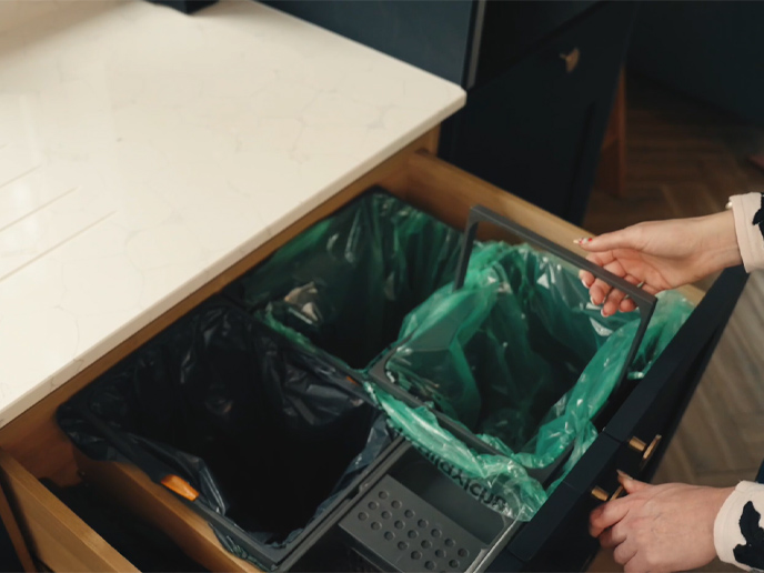 A bin fit inside a kitchen cupboard