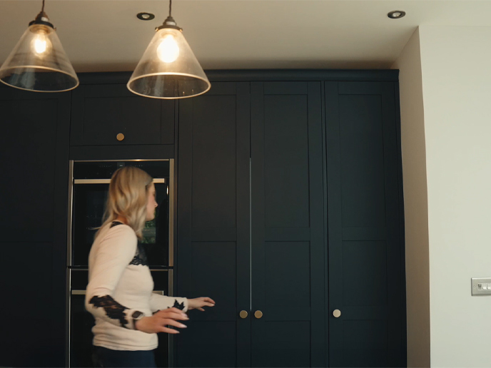 A utility room walk-in pantry and laundry