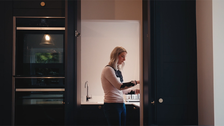 A mum in her secret utility room, hidden behind pantry doors