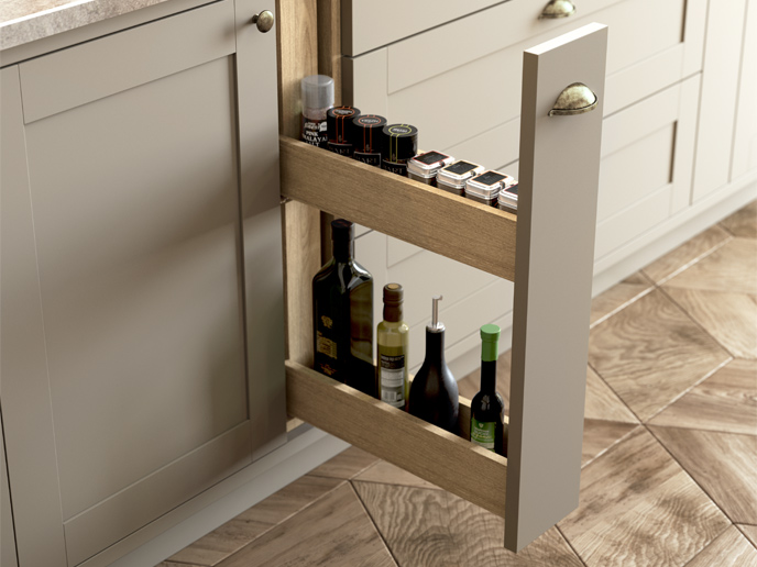 A mushroom colour kitchen cabinet with a pull-out spice rack