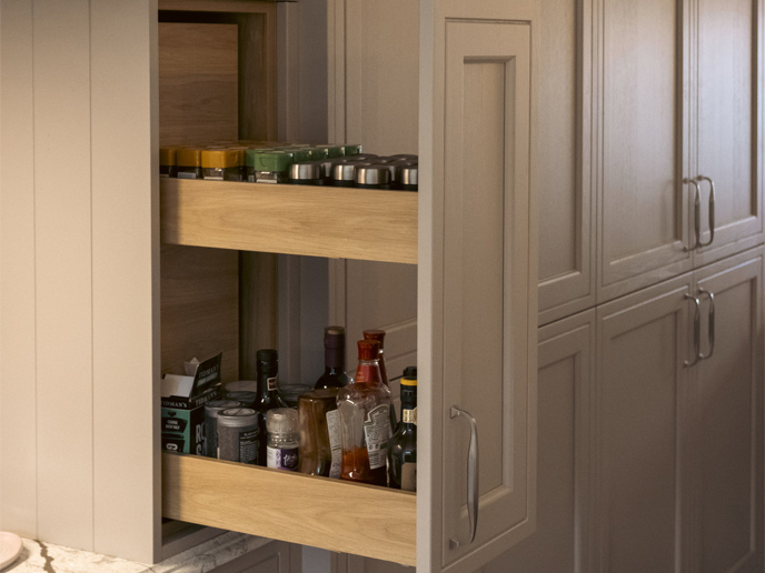 A mushroom colour kitchen pull-out spice and condiment larder