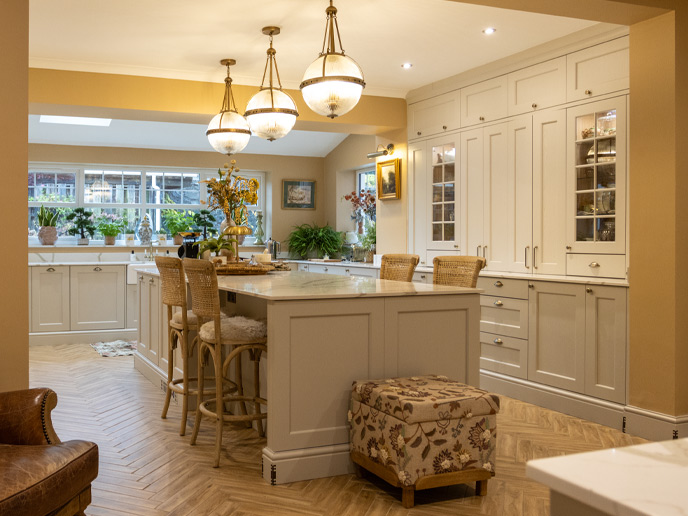 Mushroom colour kitchen cupboards combined with wood flooring