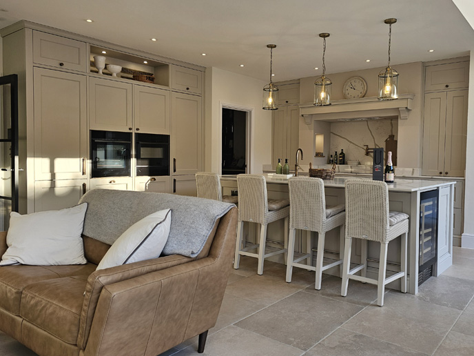 A mushroom kitchen with yellow lights and weaved chairs
