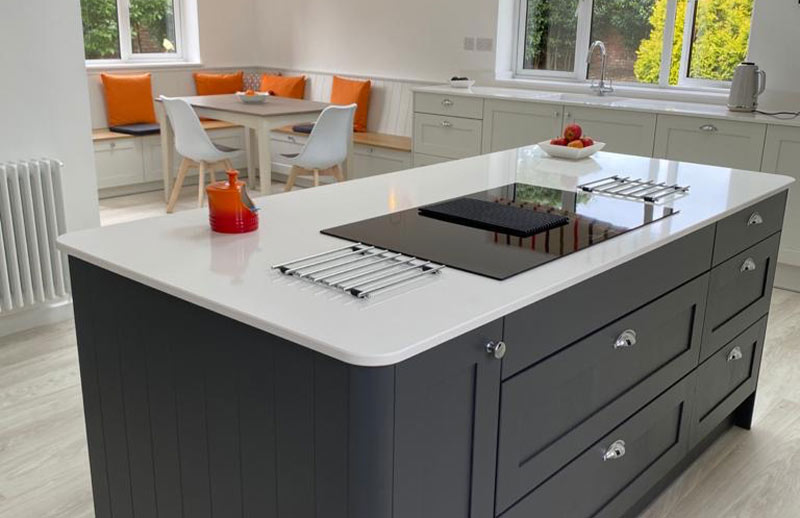 Shaker kitchen with kitchen island and bench seating in Cardiff