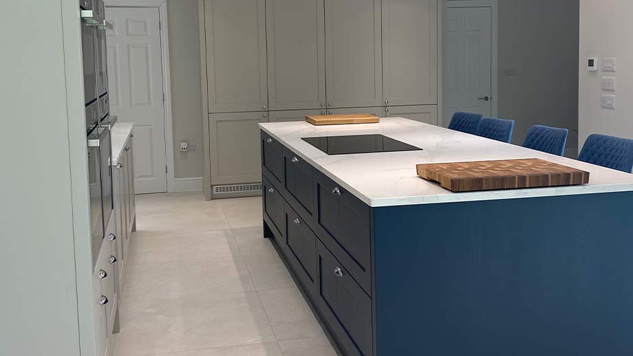 Shaker kitchen with blue kitchen island in Surrey