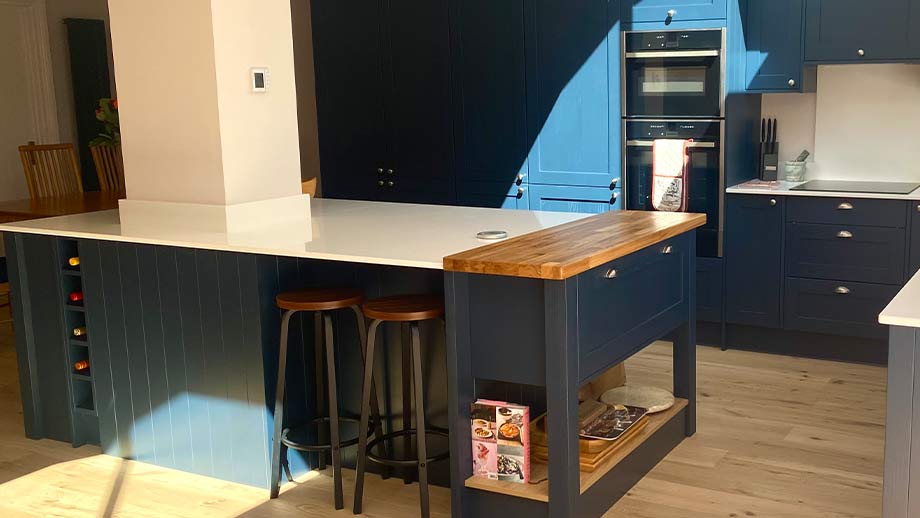 Blue shaker kitchen with chef's table in Cardiff