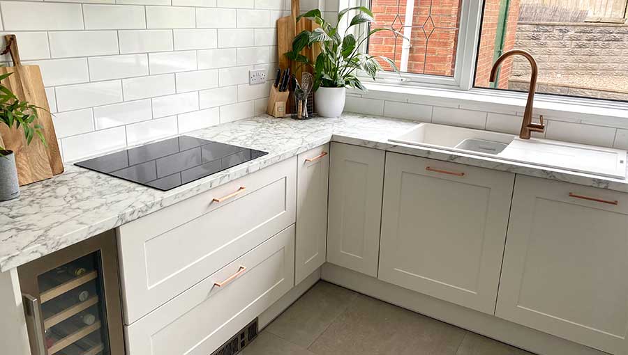 Small kitchen kitchen with copper handles in Cardiff