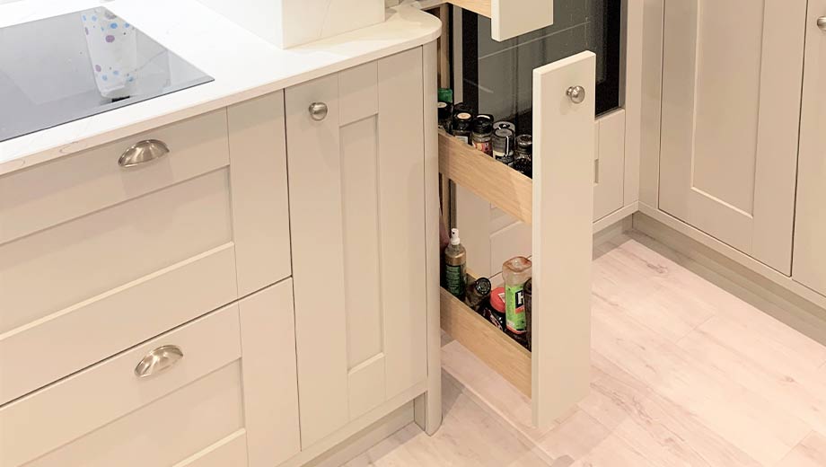 Slim pull-out larder in a grey shaker kitchen