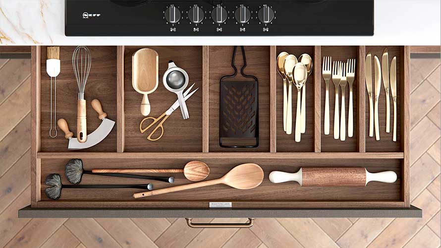 Wood finish cutlery drawers in a traditional kitchen