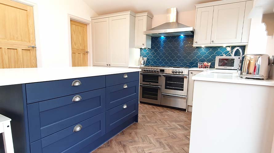 Traditional kitchen in Cardiff featuring blue kitchen island