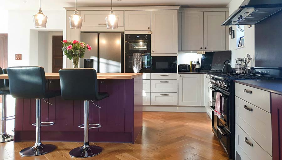 Two tone kitchen with purple kitchen island