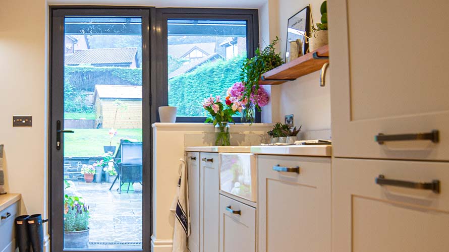 Open shelving in a grey utility room