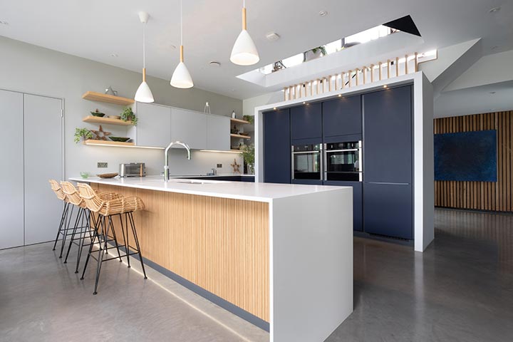 Blue handleless kitchen by designer Martyn Harris in our Cardiff Kitchen Showroom